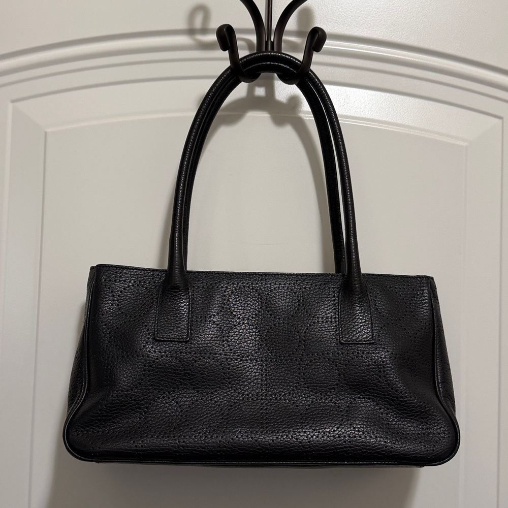 Kate Spade black ‘punched Noel’ leather top-handle bag.